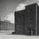 Links ehemaliges Verwaltungsgebäude der HASAG, anschließend Unterkunft "Amstel" für zivile Zwangsarbeiter:innen, vor 1939 (GfZL/Sammlung Garrit Hoffmann)